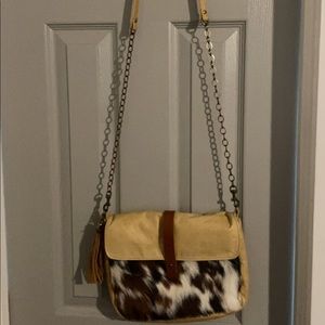 Canoe cowhide crossbody bag
